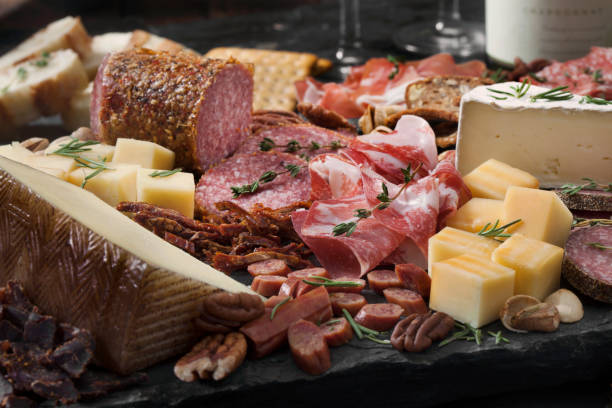 Deli counter with various meats and cheeses